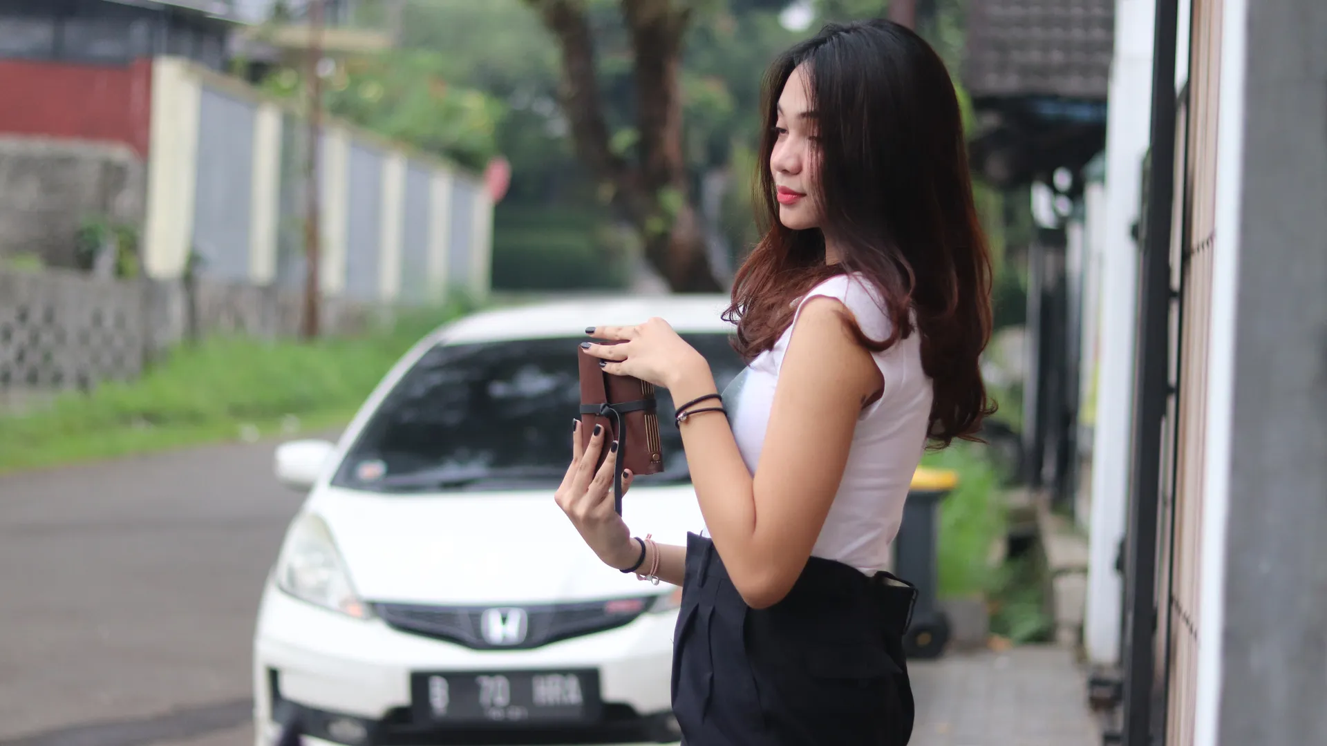 Woman Holding Hibrkraft Leather Notebook