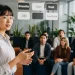 Businesswoman Giving Presentation To Team Meeting