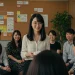 Woman Giving Thank You Card Team Meeting