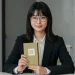 Woman Holding Eco Notebook Portrait