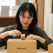 Woman Packing Boxes Hibrkraft Shipping