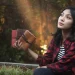 Girl Holding Journals Outdoors Dreamy Scene
