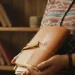 Person Holding Leather Journal Indoors Cozy