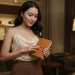 Woman Holding Leather Notebook Store