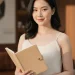 Woman Holding Notebook Casual Portrait 1